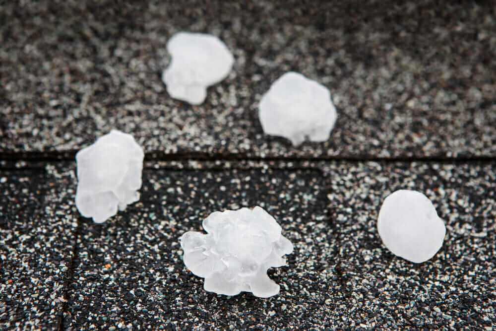 Hail damage to a residential roof after a storm in Amarillo, TX